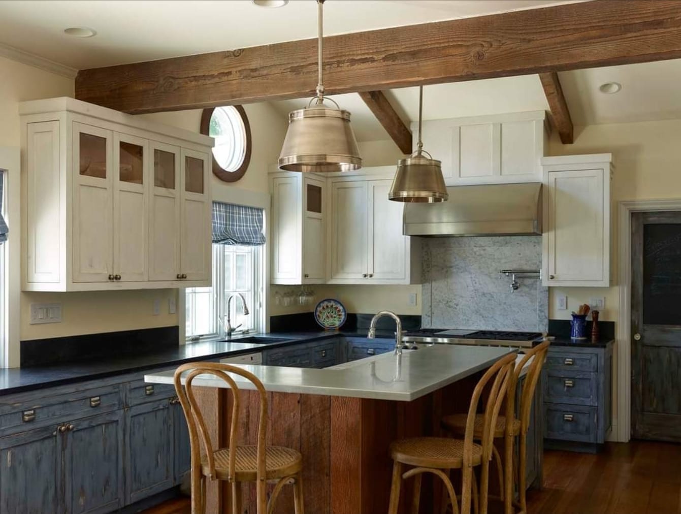 Refinished white kitchen with island and natural-wood floors
