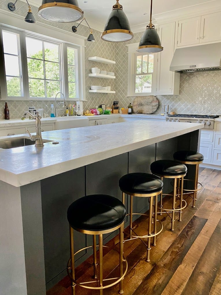 Charcoal island with marble top and counter stools
